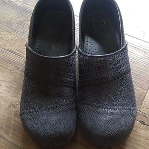 Navy blue Sanita clogs.